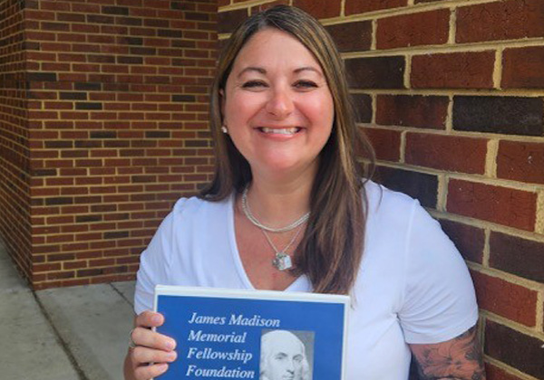 Janet Costello holding her James Madison Award