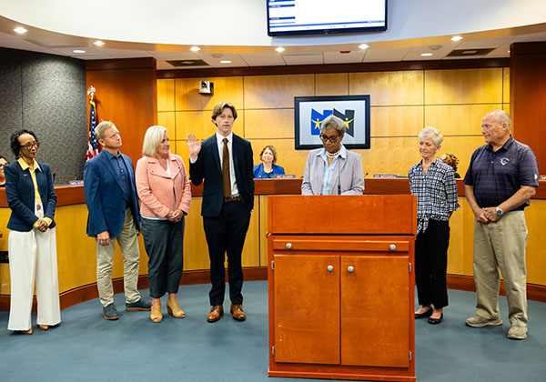 Student Representative to the School Board Cameron Smith takes the Oath of Commitment.