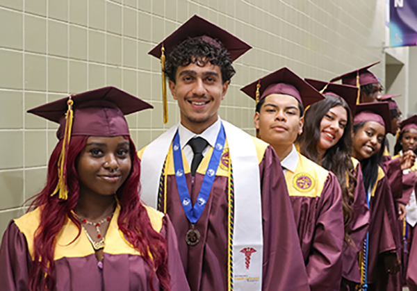 New one-stop scholarship portal for students, families; photo showing NNPS graduates.